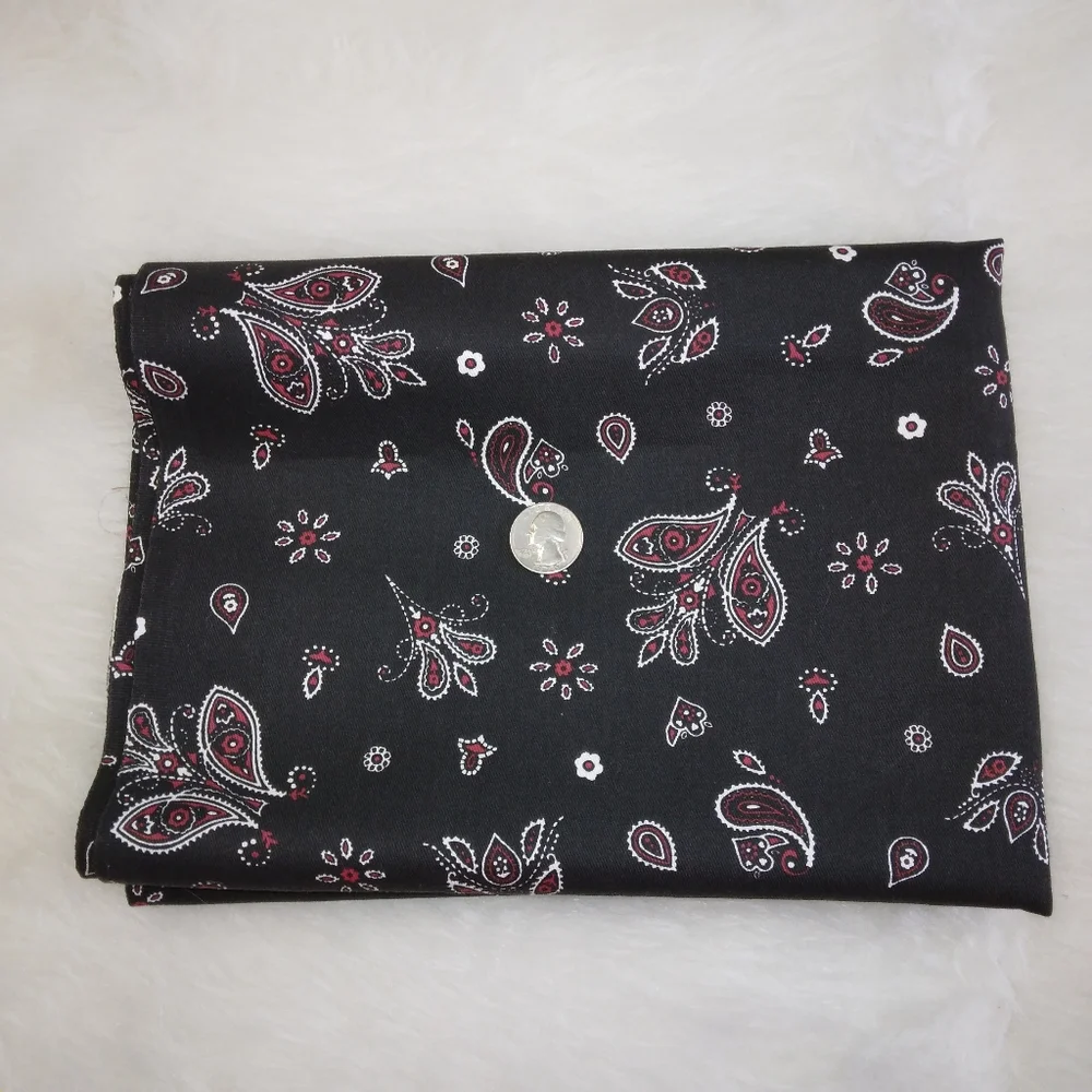FABRIC Red and white paisley print on black background, twill weave